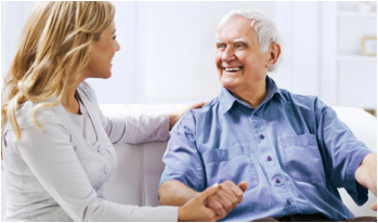 Guardian caregiver sitting with an older client